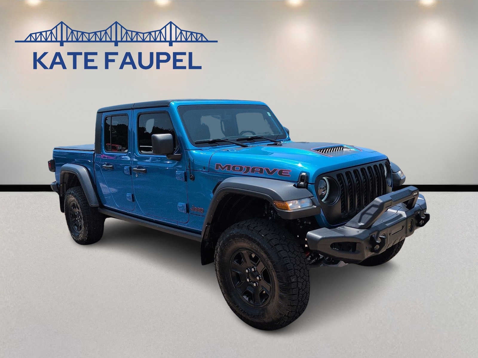2023 Jeep Gladiator Mojave in Hydro Blue Pearlcoat — front three-quarter view